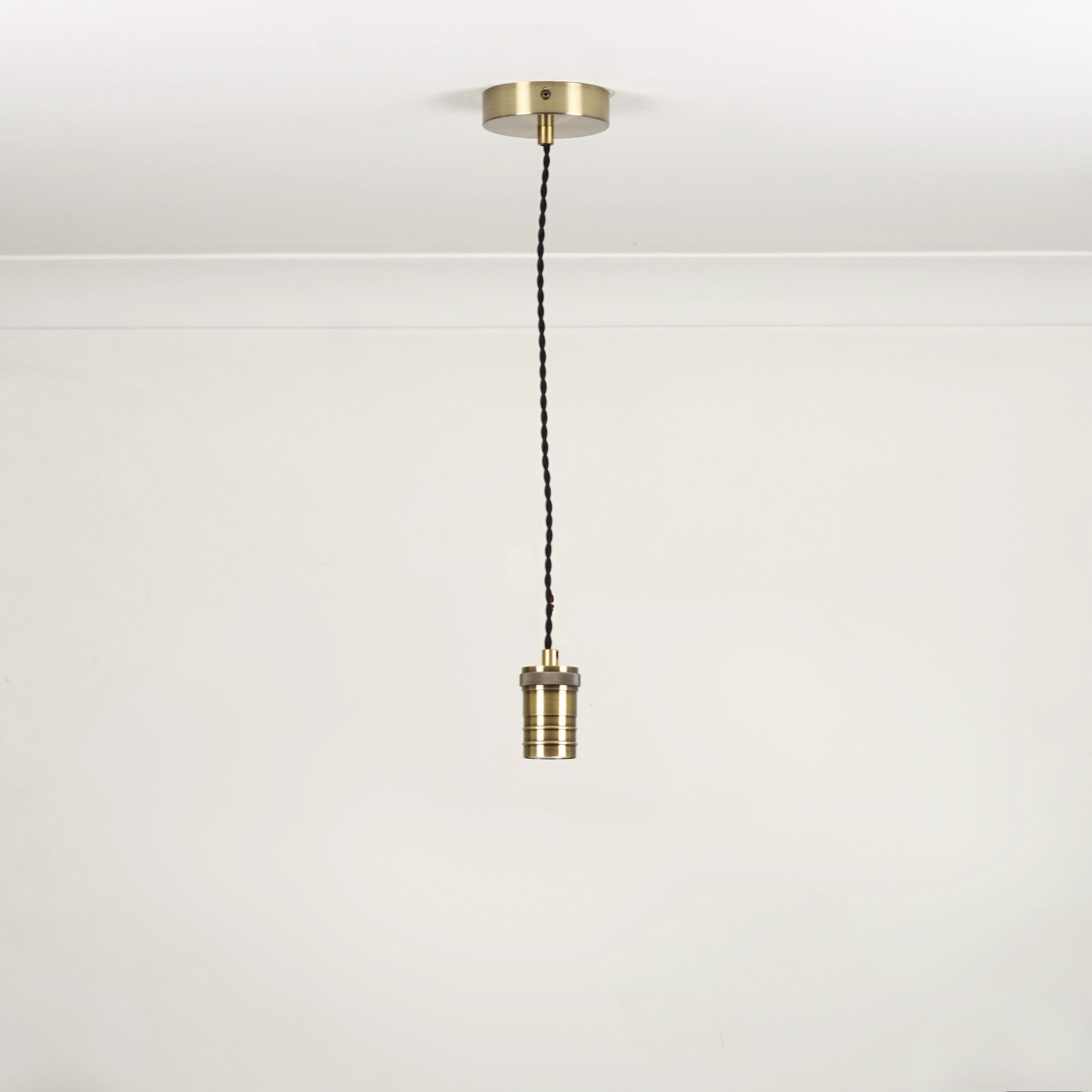 Bronze twisted single pendant white background