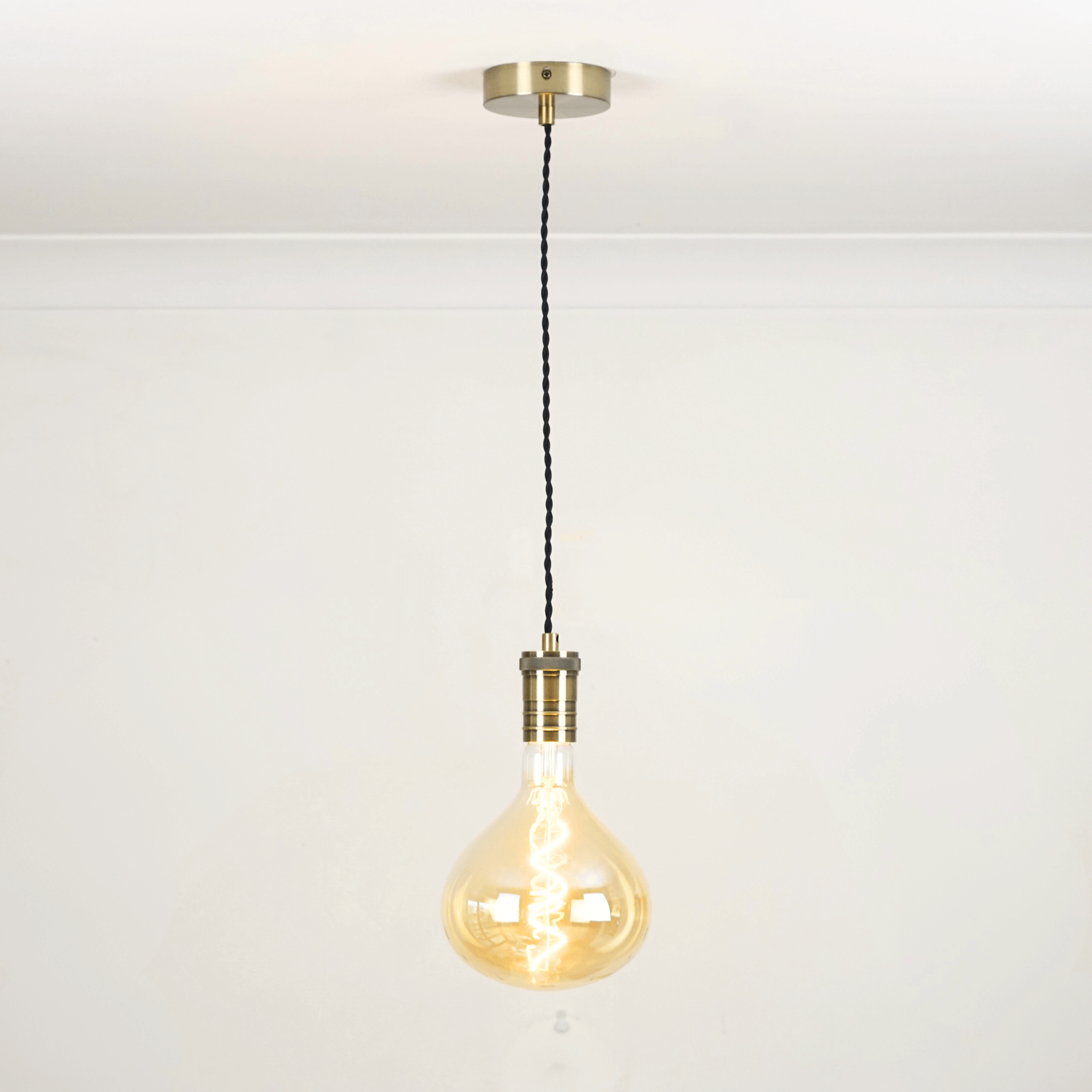 Bronze twisted single pendant white background with olivia bulb