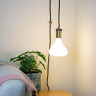 antique bronze plug in pendant light and straight cable astrid bulb in living room on