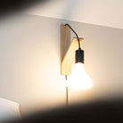 astrid plug in wall light in matte black focus