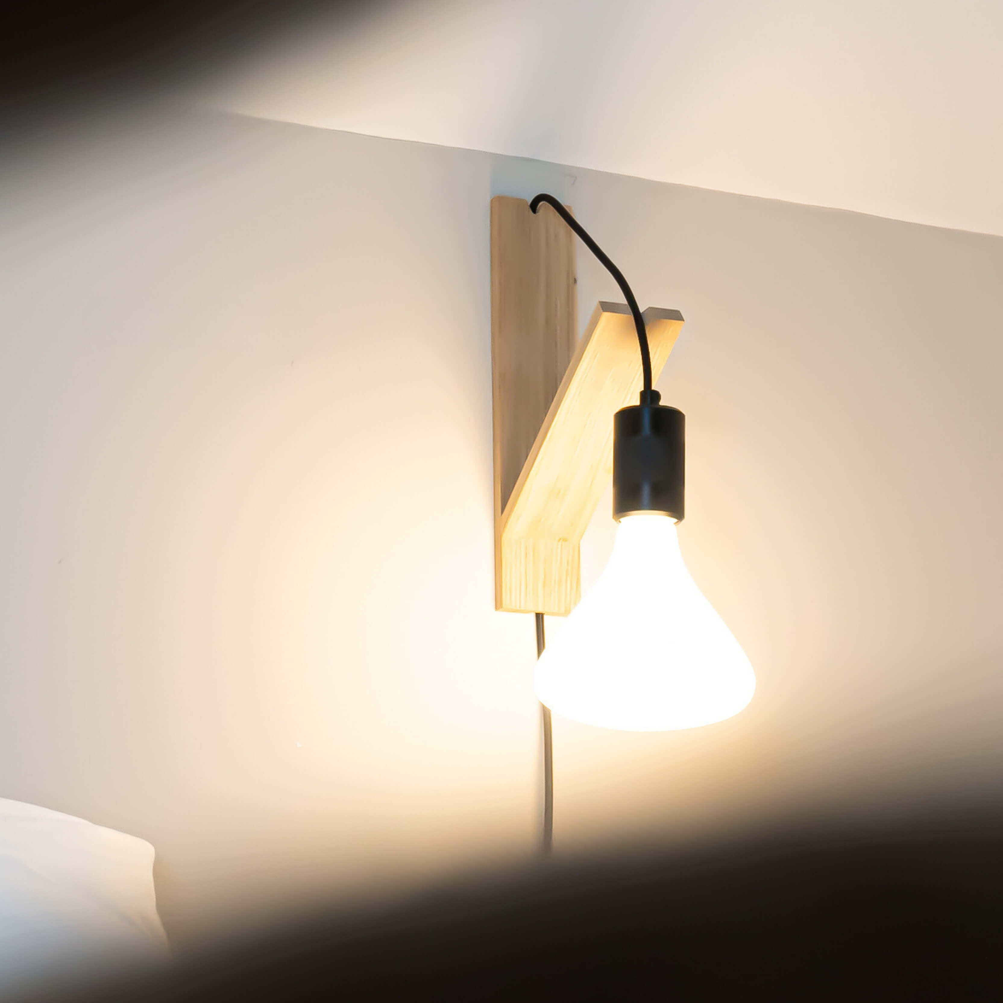 astrid plug in wall light in matte black focus