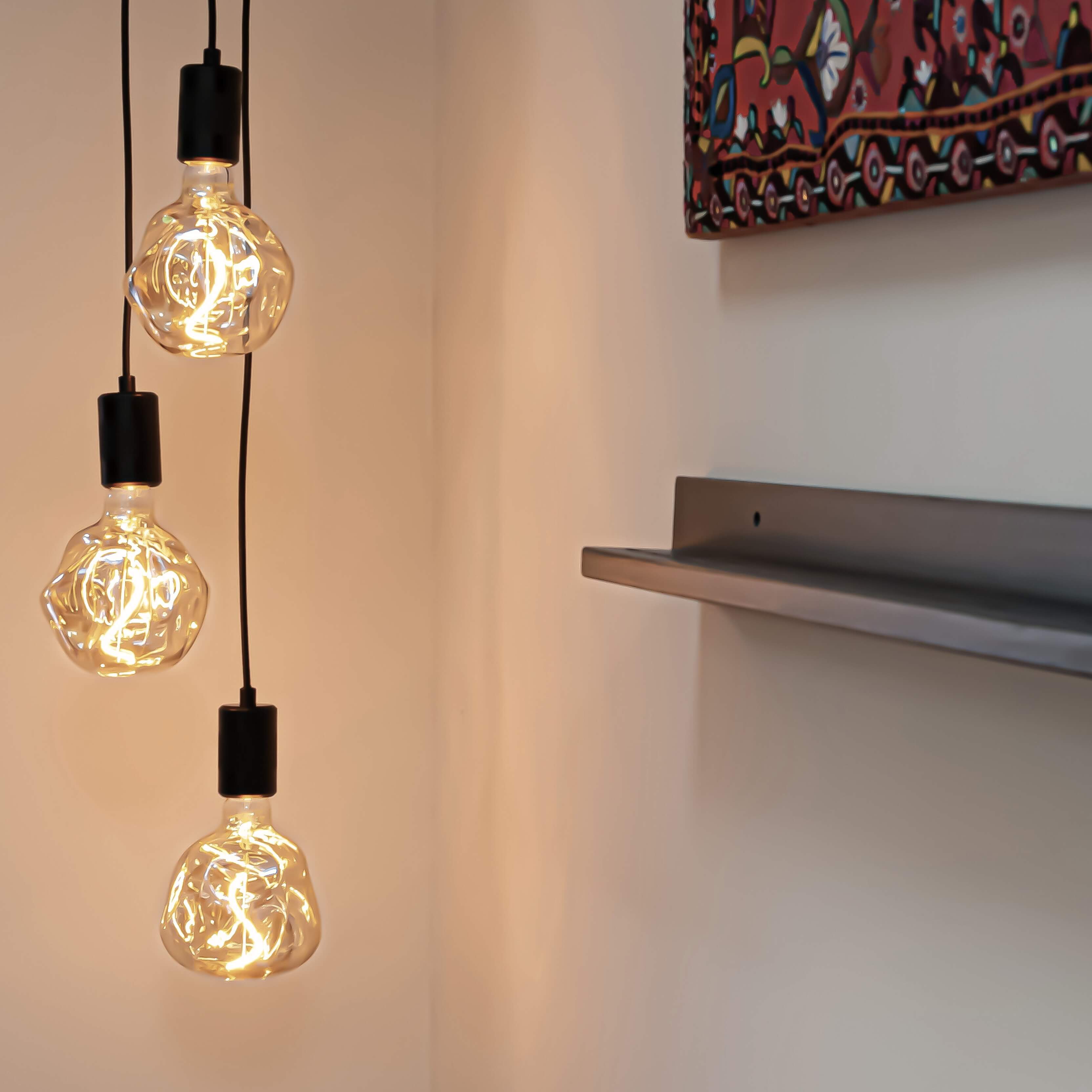 Black cluster pendant with isabella bulbs in the living room