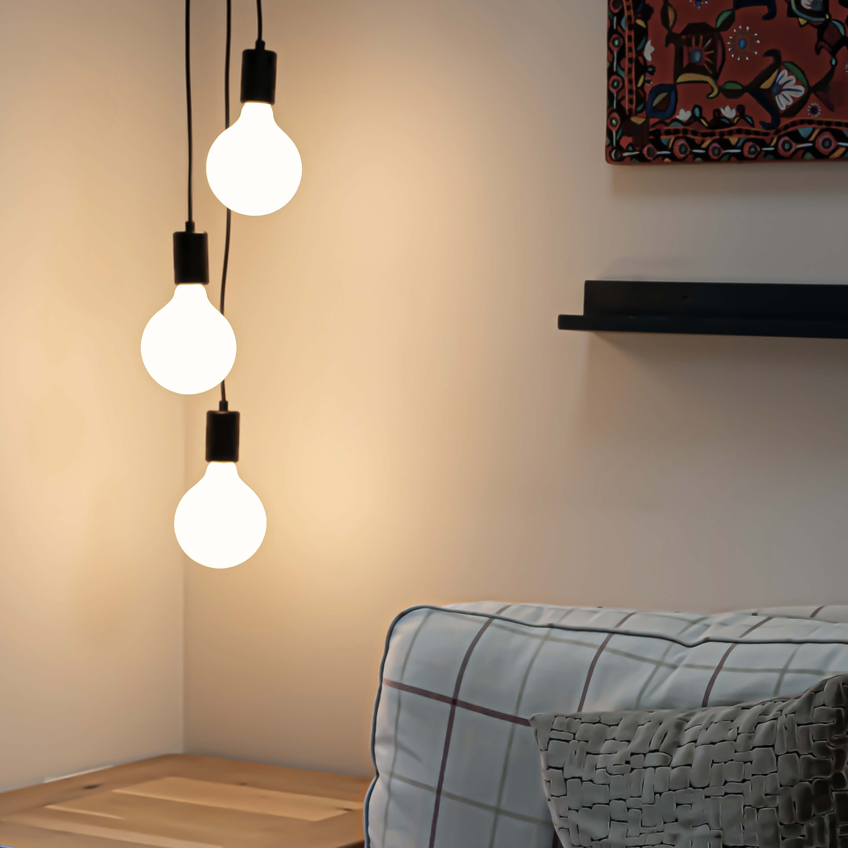 black cluster pendant with luna bulbs in the living room