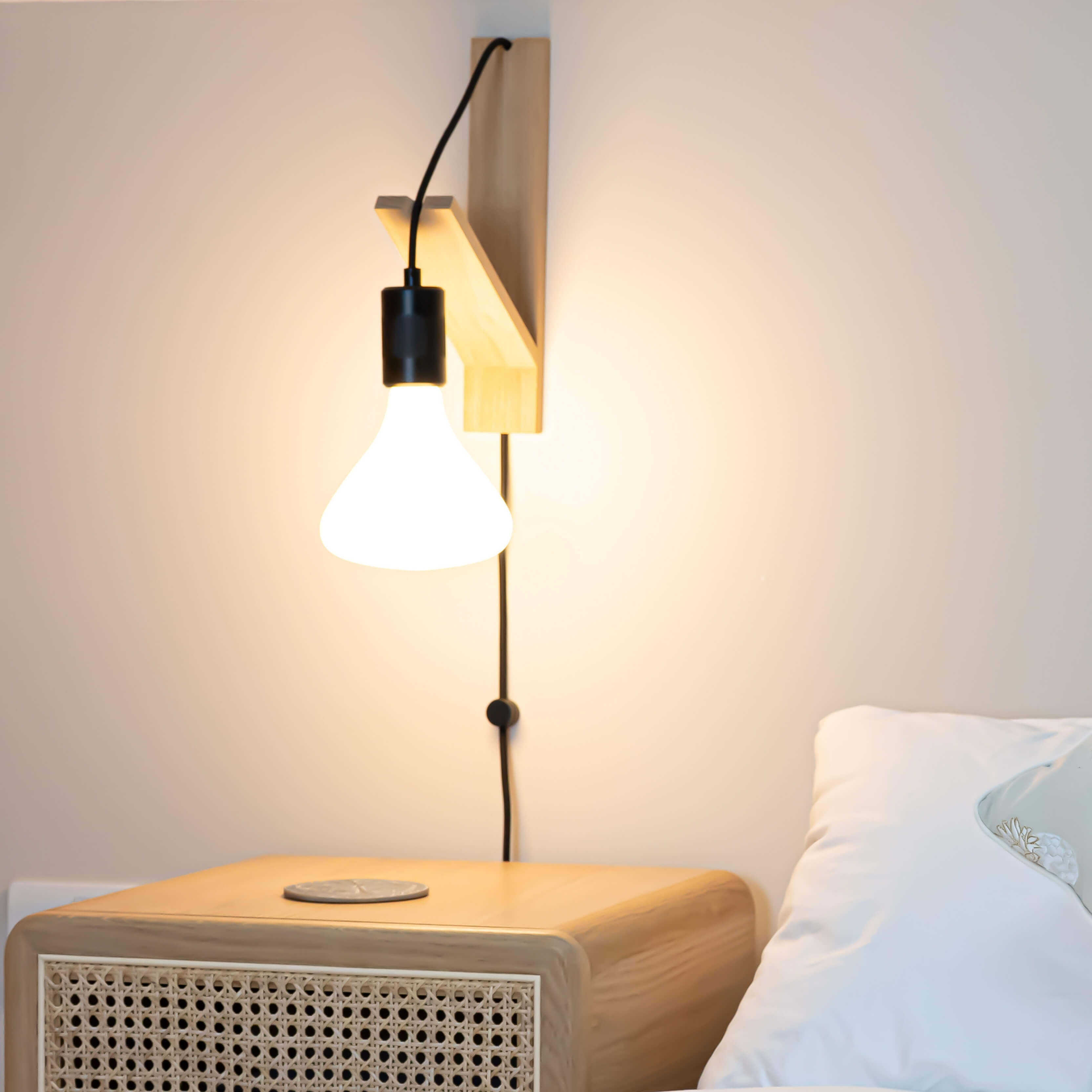 black plug in wall light in matte black