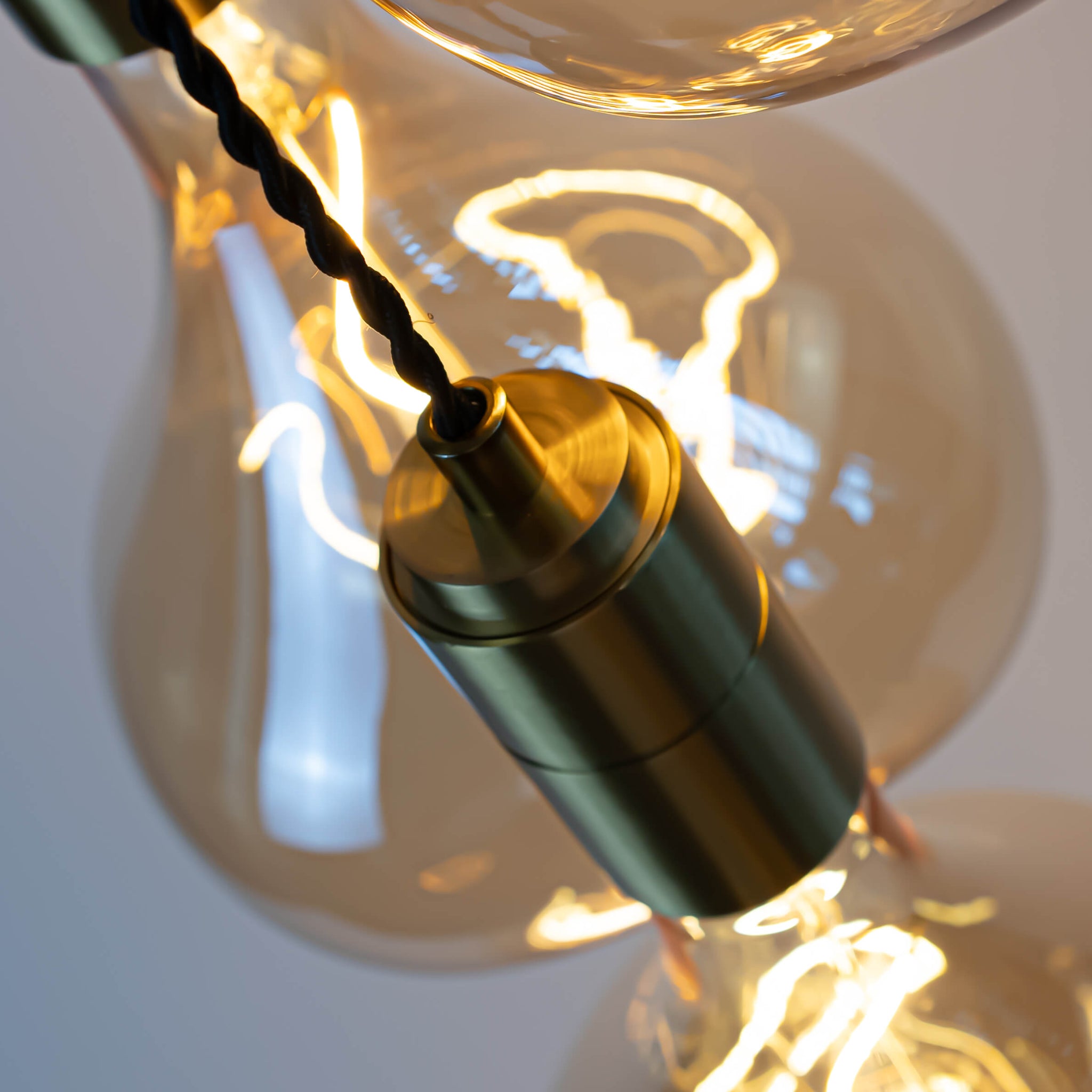 brass cluster pendant lights with céleste bulb closeup