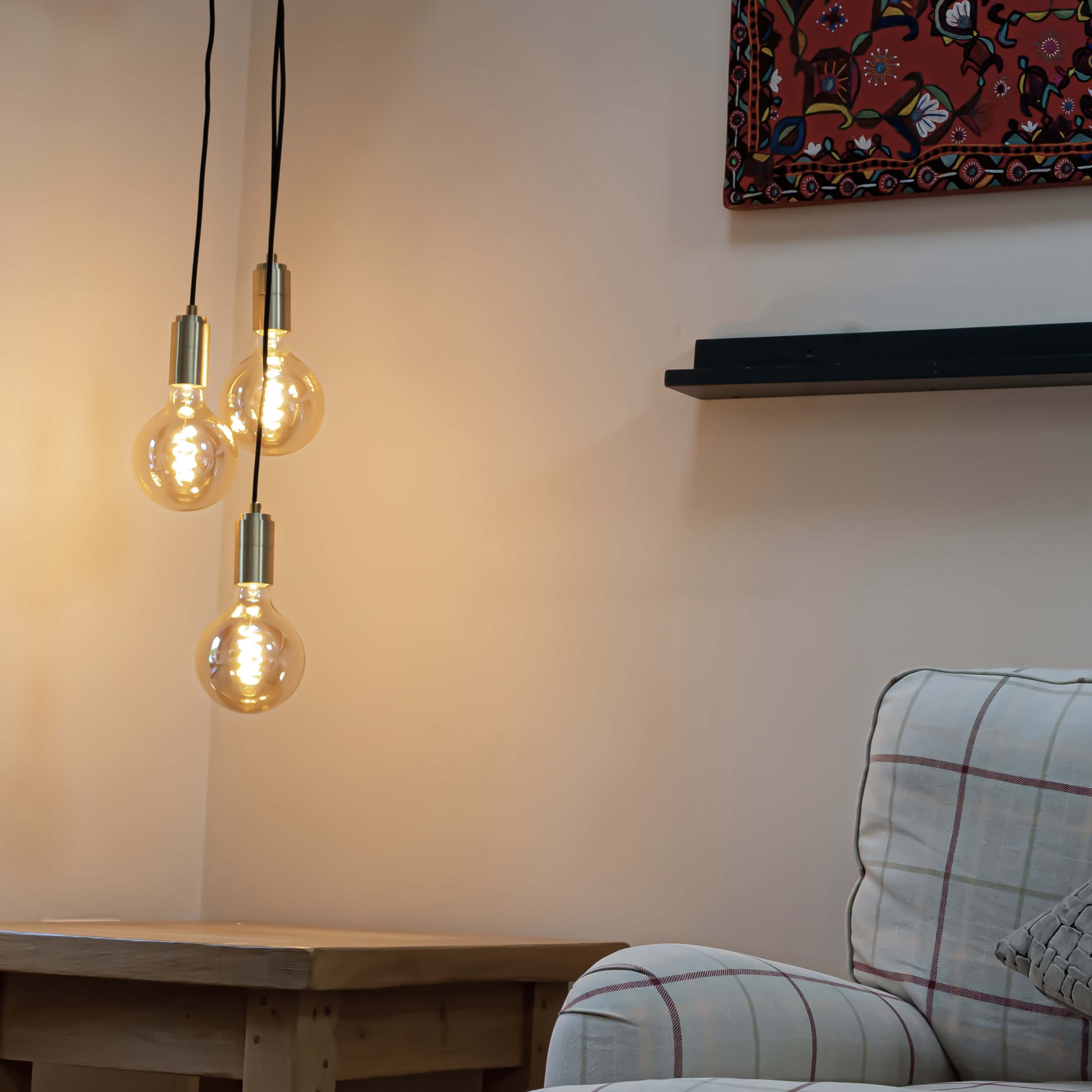 Brass cluster pendant with straight cable and sophia bulbs in the living room