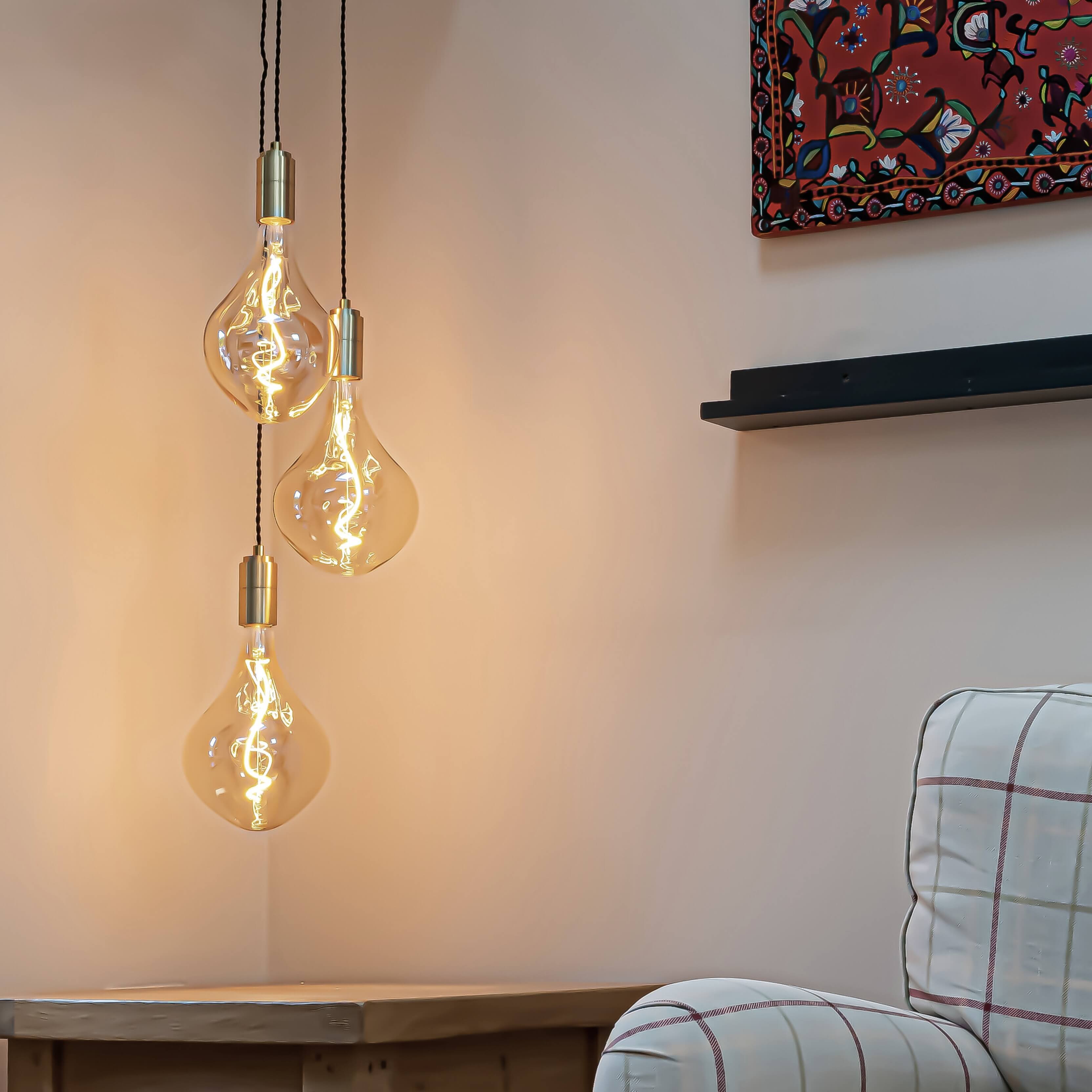 Brass cluster pendant with twisted cable and Celeste bulbs in the living room