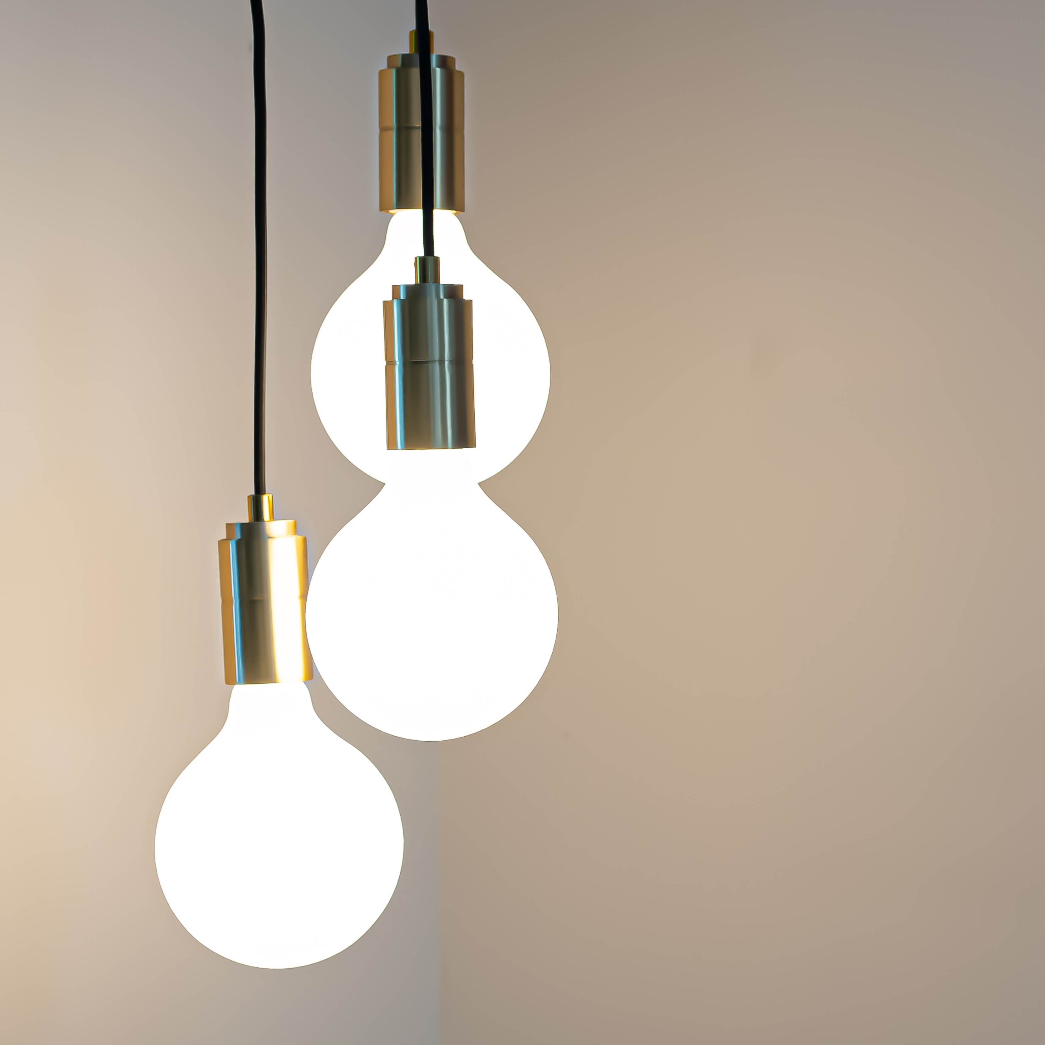 Brass cluster pendant with twisted cable and luna bulbs in the living room