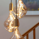 Brass cluster pendant with twisted cable and Celeste bulbs hallway