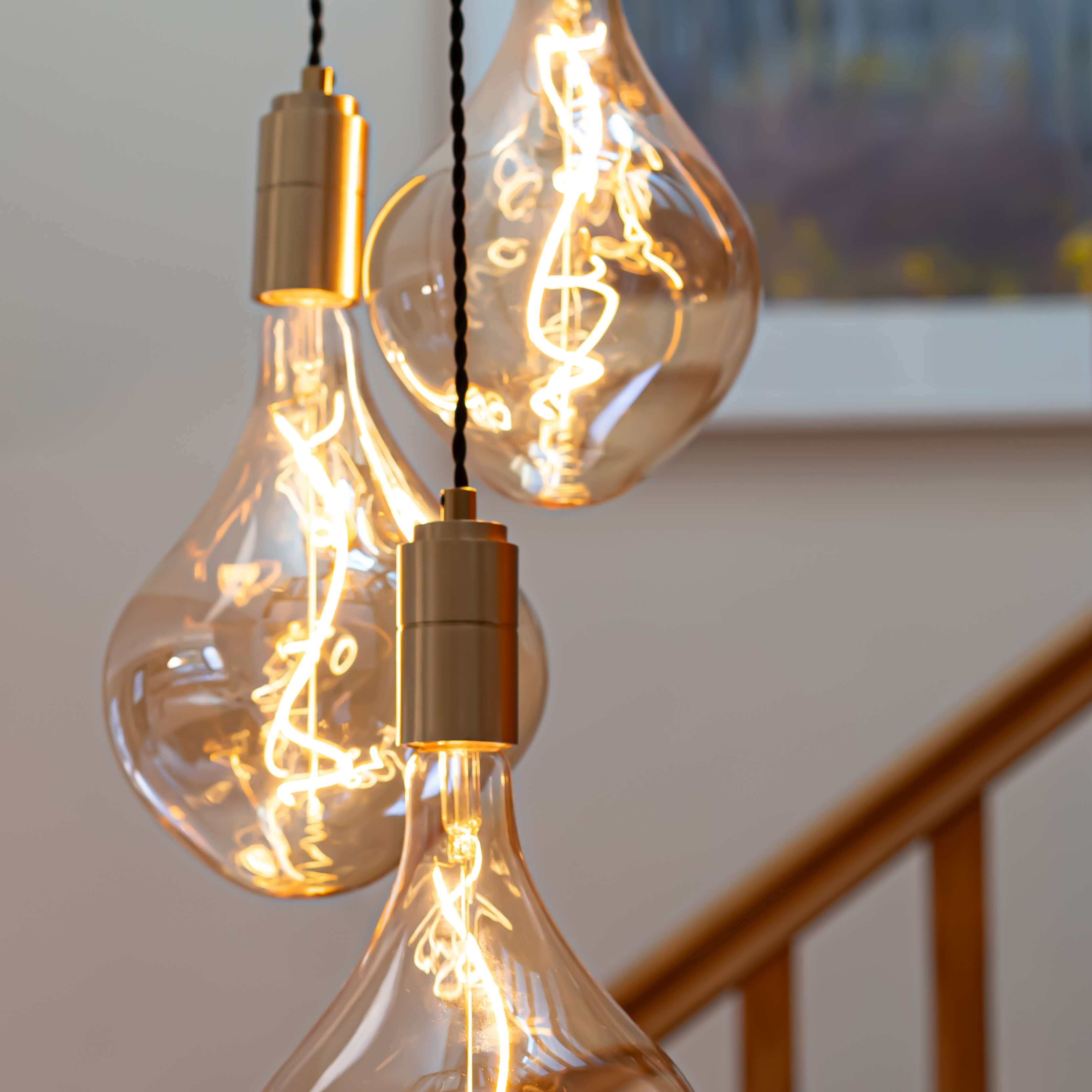 Brass cluster pendant with twisted cable and Celeste bulbs hallway