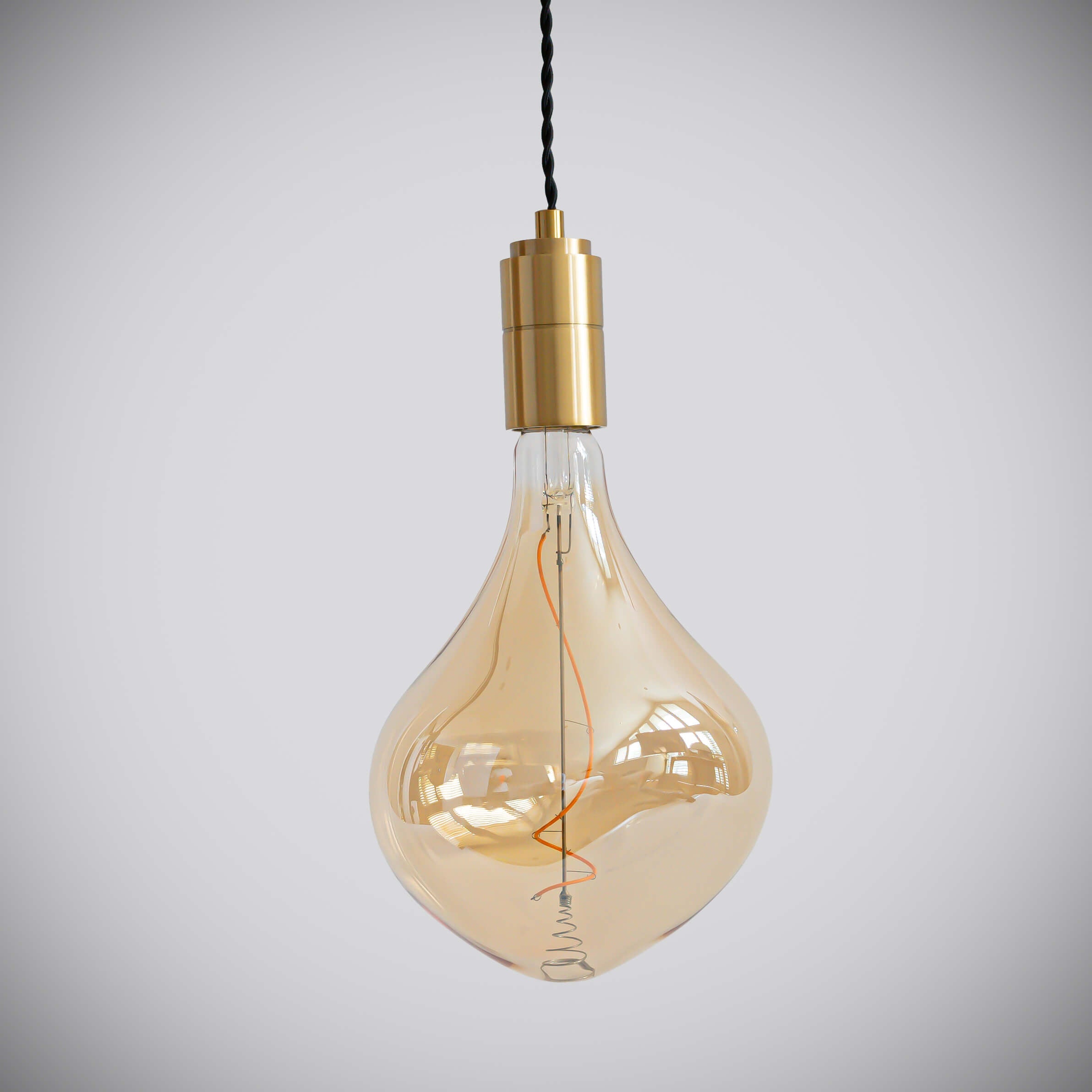 brass pendant light with twisted cable and céleste bulb off