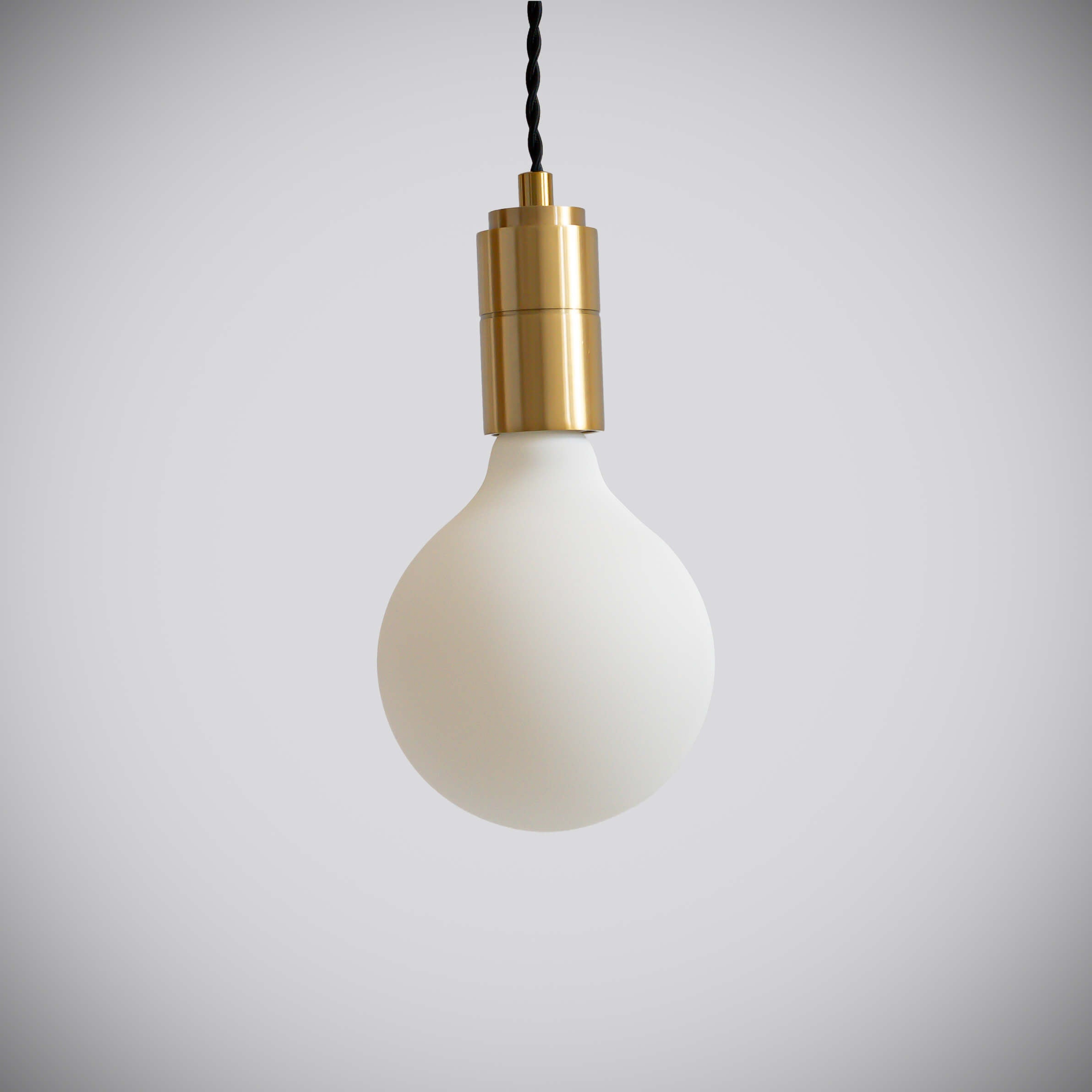 brass pendant light with twisted cable and luna bulb off