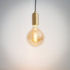 brass pendant light with twisted cable and sophia bulb on