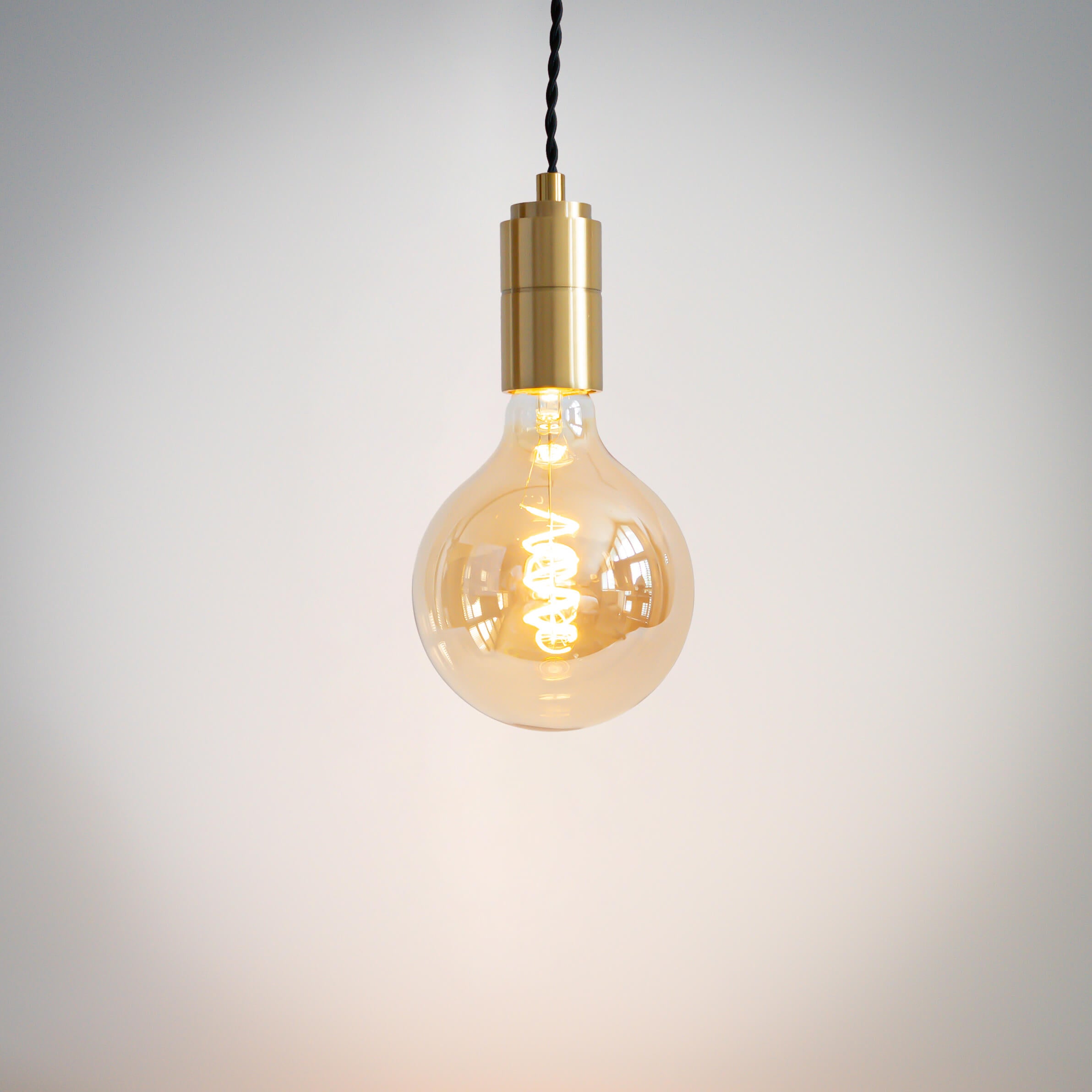 brass pendant light with twisted cable and sophia bulb on