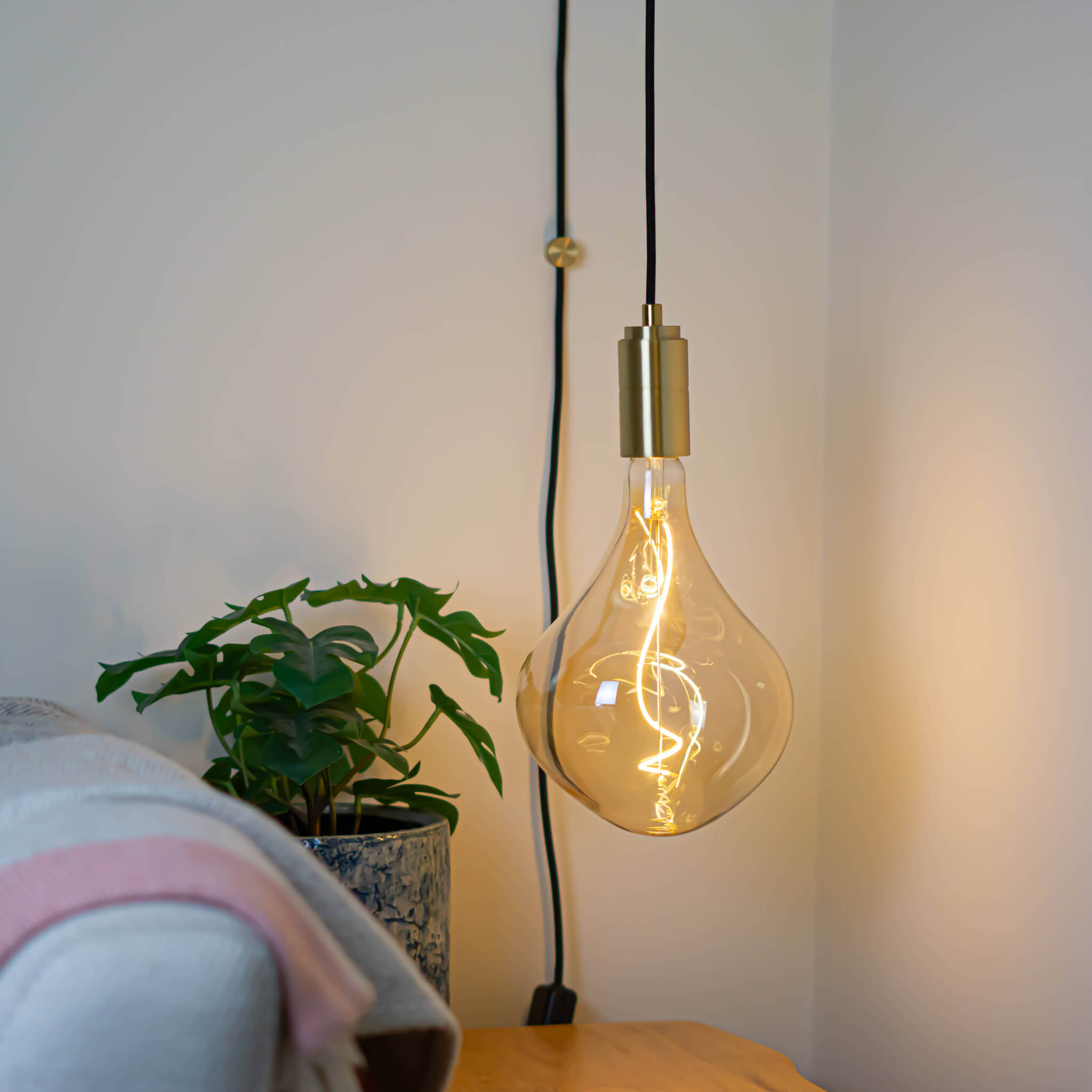 brass plug in pendant light and straight cable with celeste bulb in living room on
