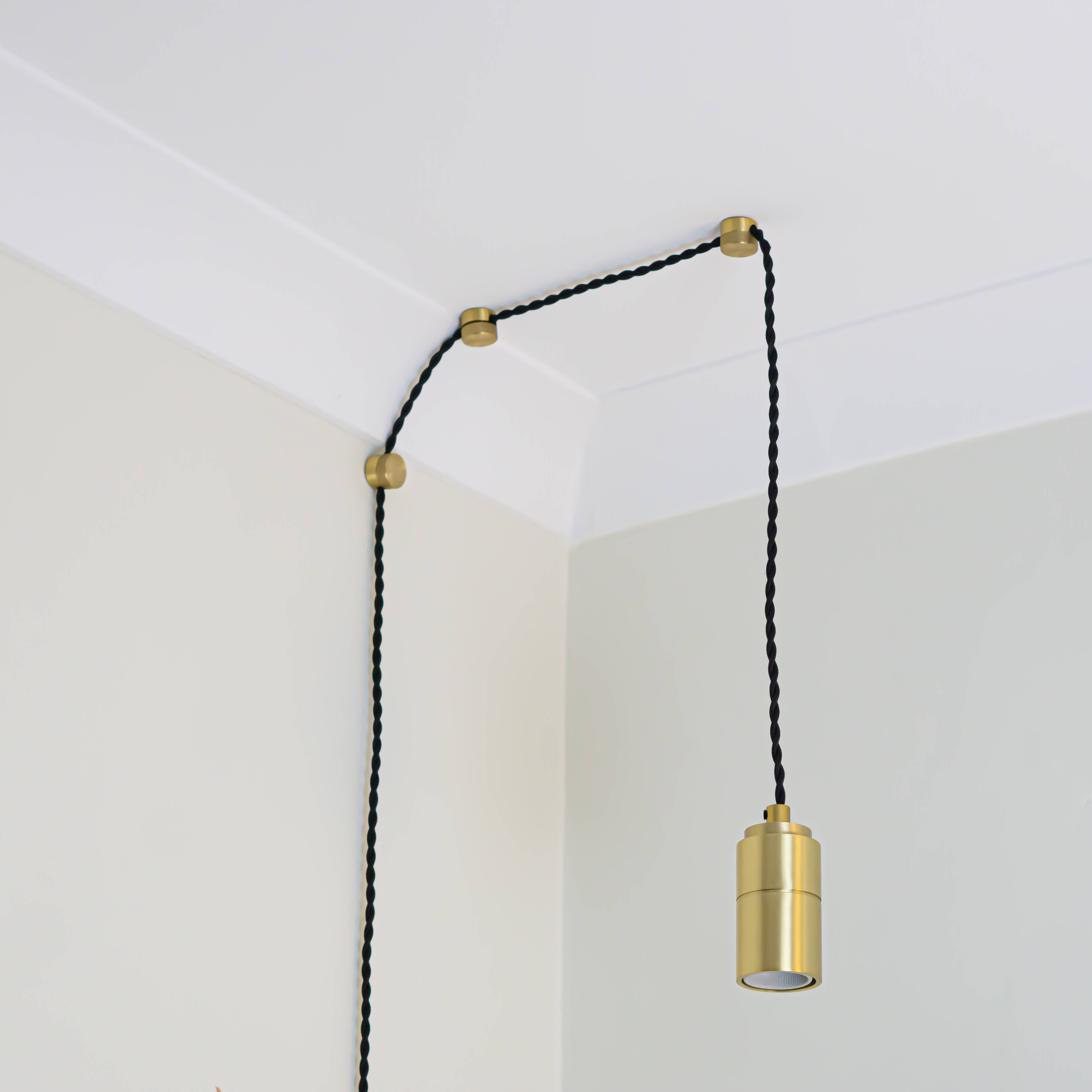 brass plug in pendant light with twisted cable assembled with no bulb