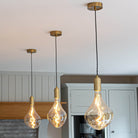 celeste brass pendant light above kitchen island