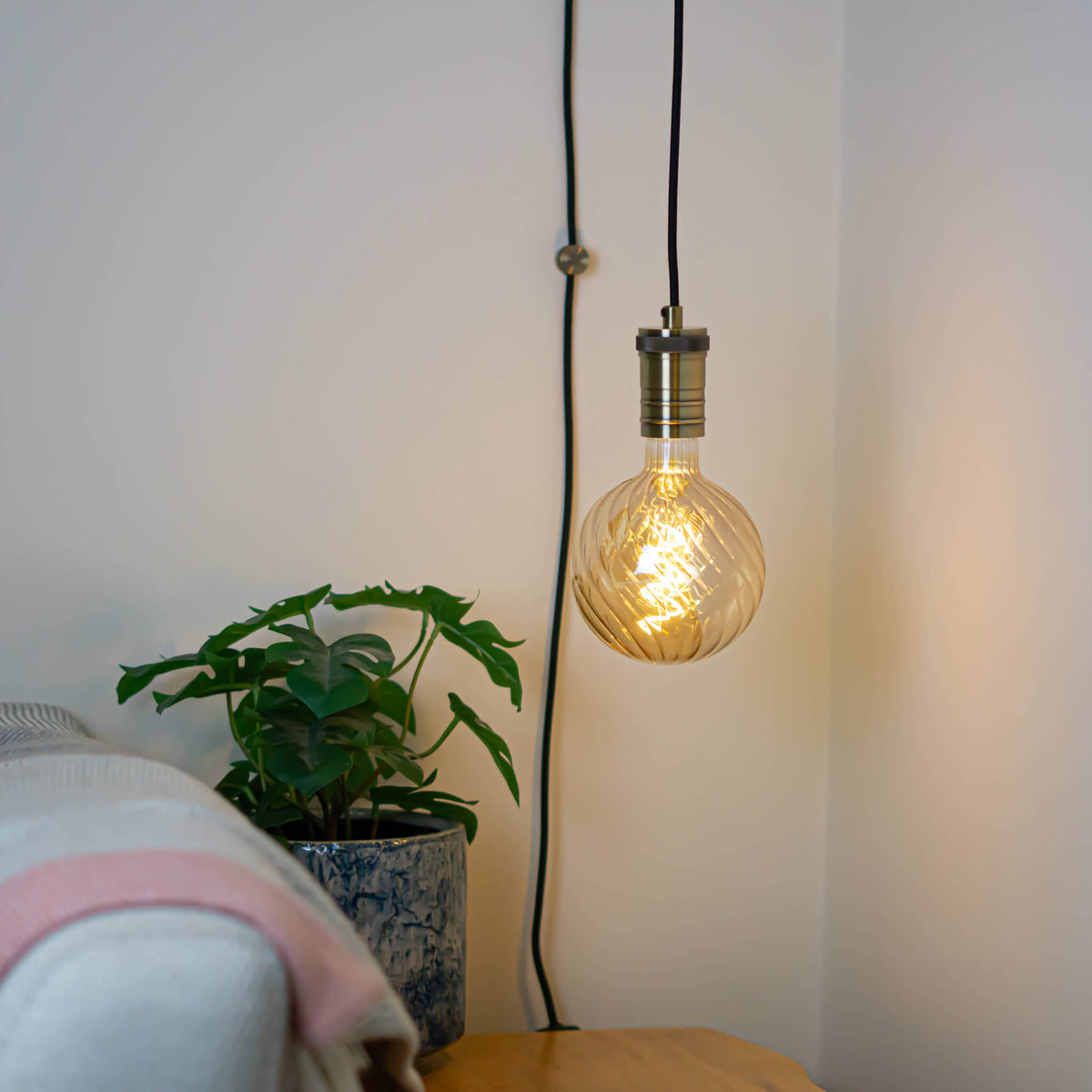 antique bronze plug in pendant light and straight cable felicity bulb in living room on