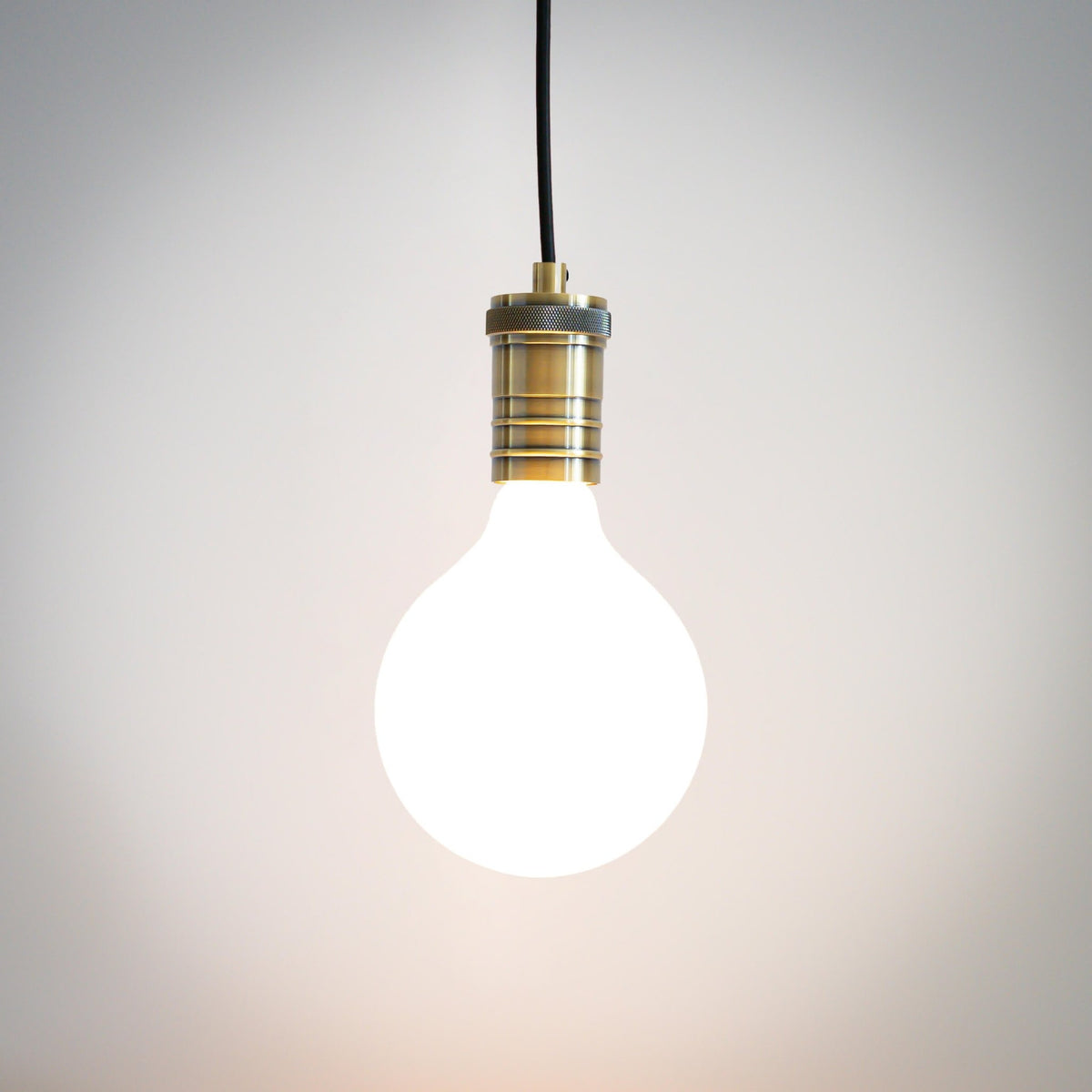 antique bronze pendant light with straight cable and luna bulb on