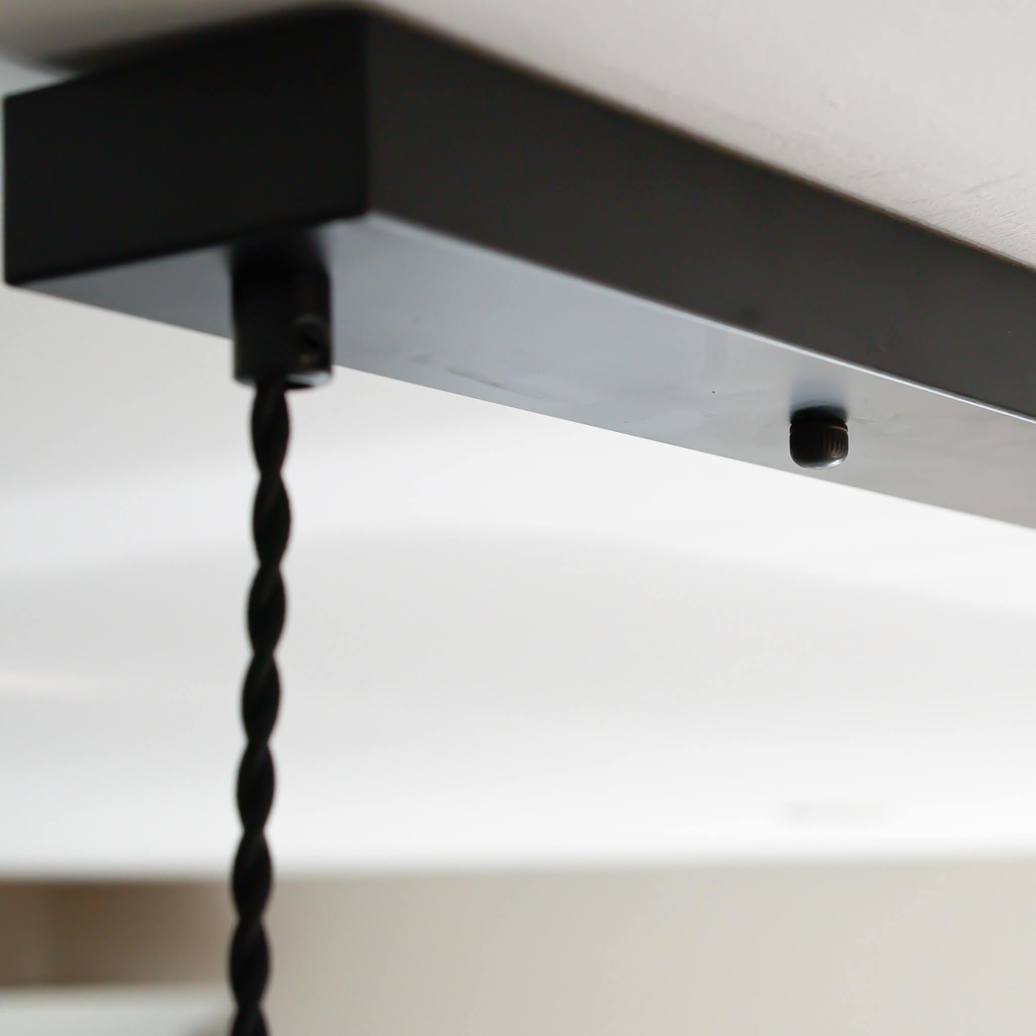 matte black ceiling rose with twisted cable closeup