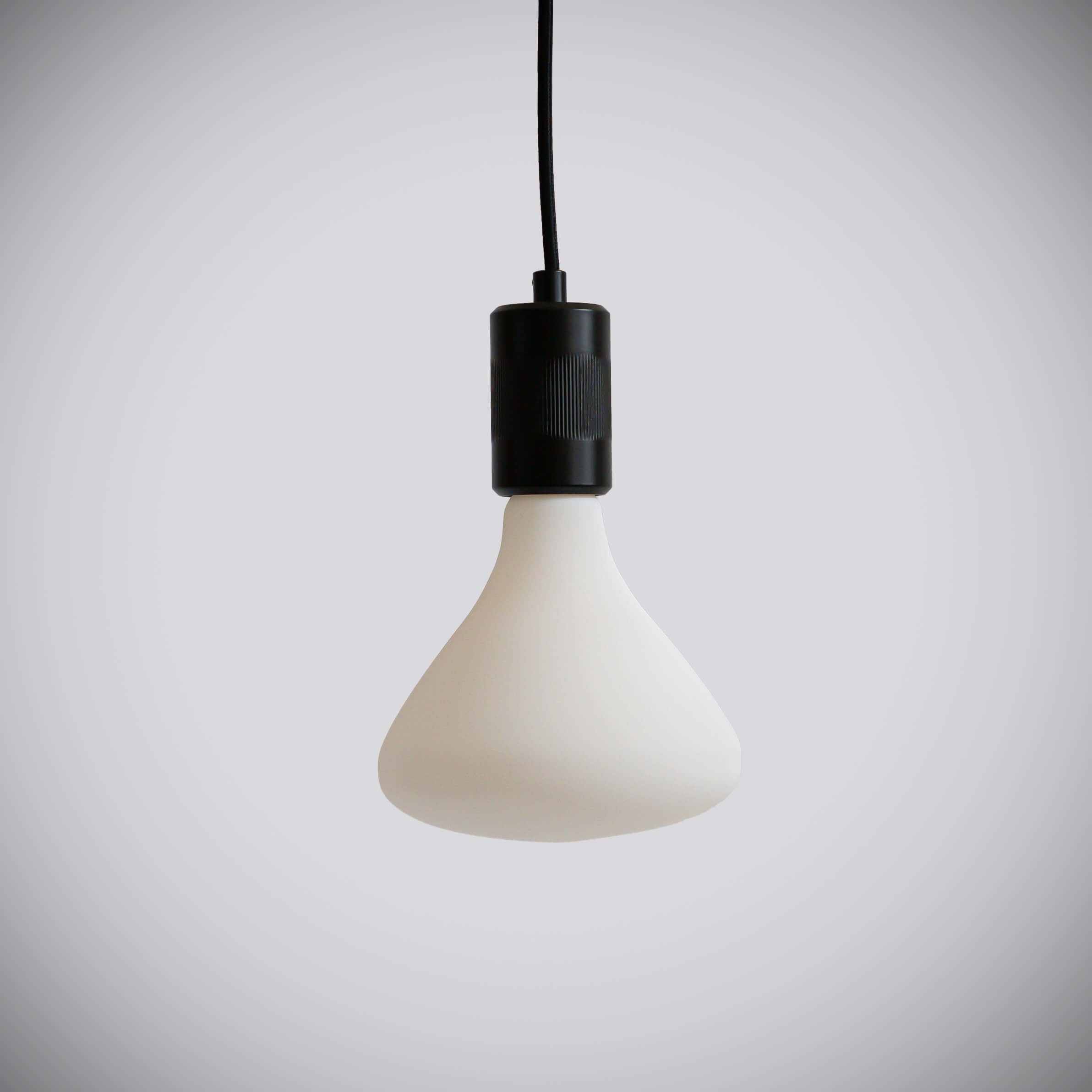 matte black pendant light and astrid bulb off