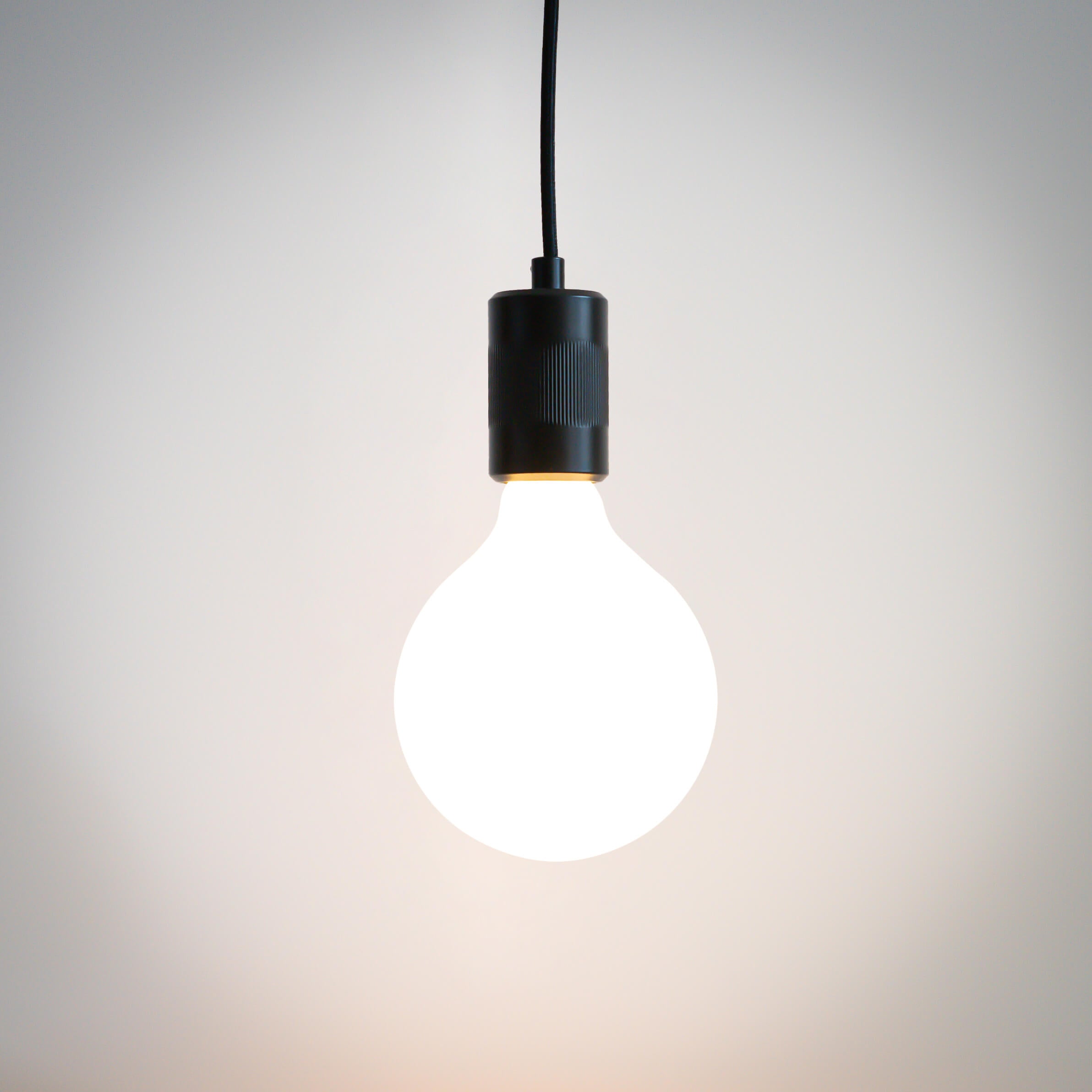 matte black pendant light and luna bulb on