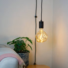 matte black plug in pendant light isabella bulb in living room on