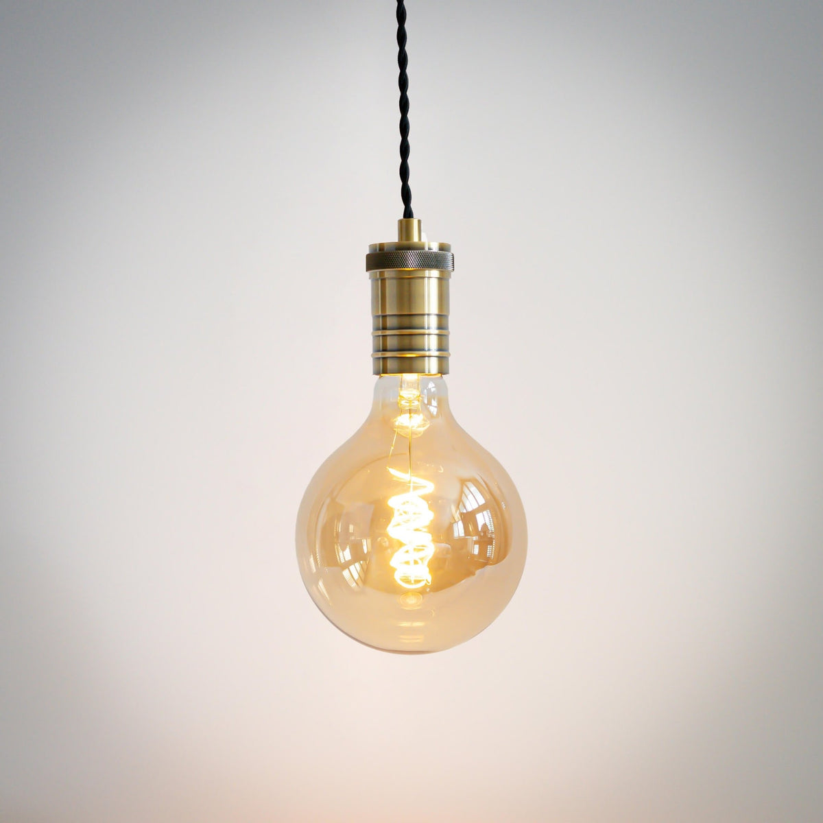 antique bronze pendant light with twisted cable and sophia bulb on