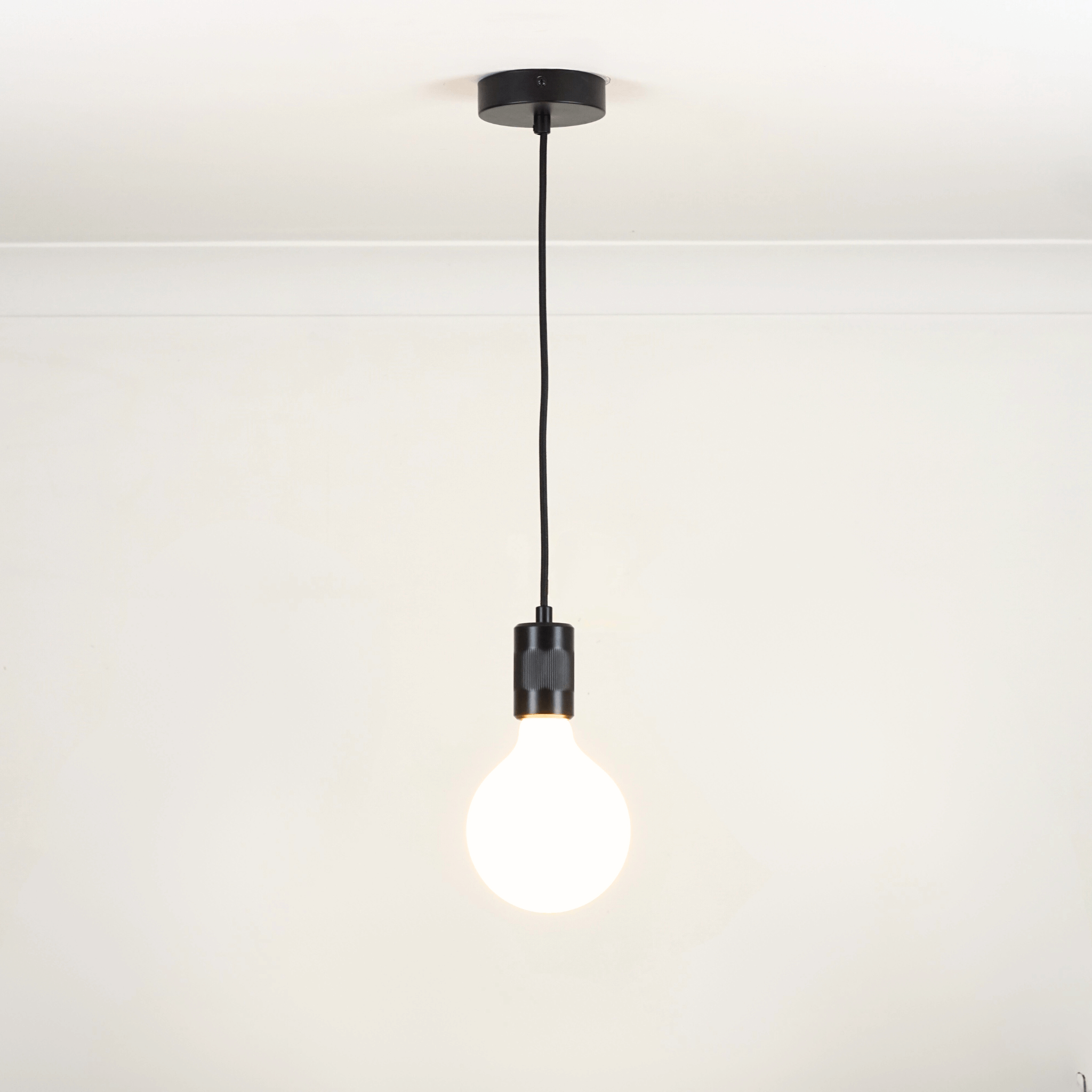 Black single pendant white background with luna bulb