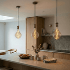 Antique brass straight pendant over kitchen island