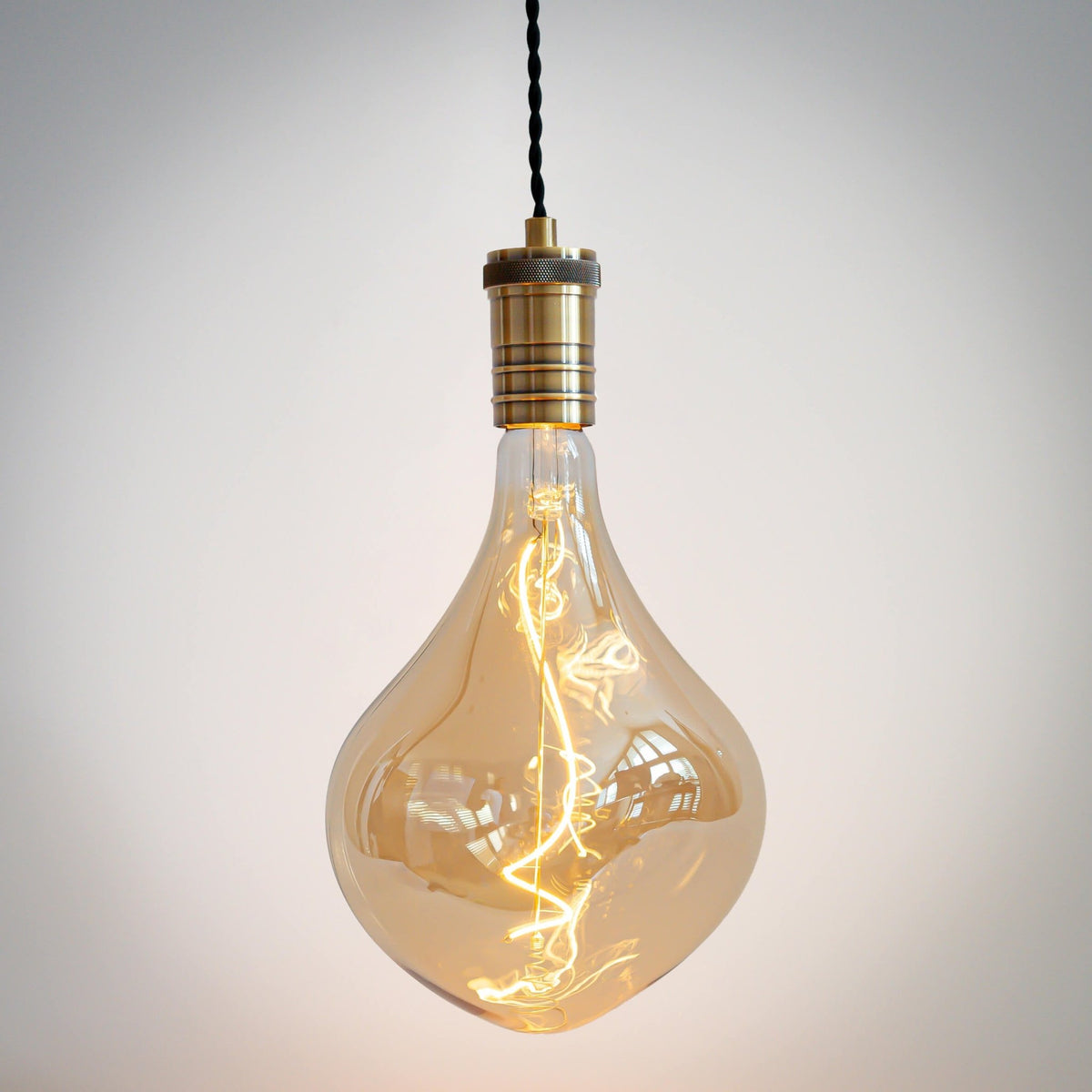 antique bronze pendant light with twisted cable and céleste bulb on