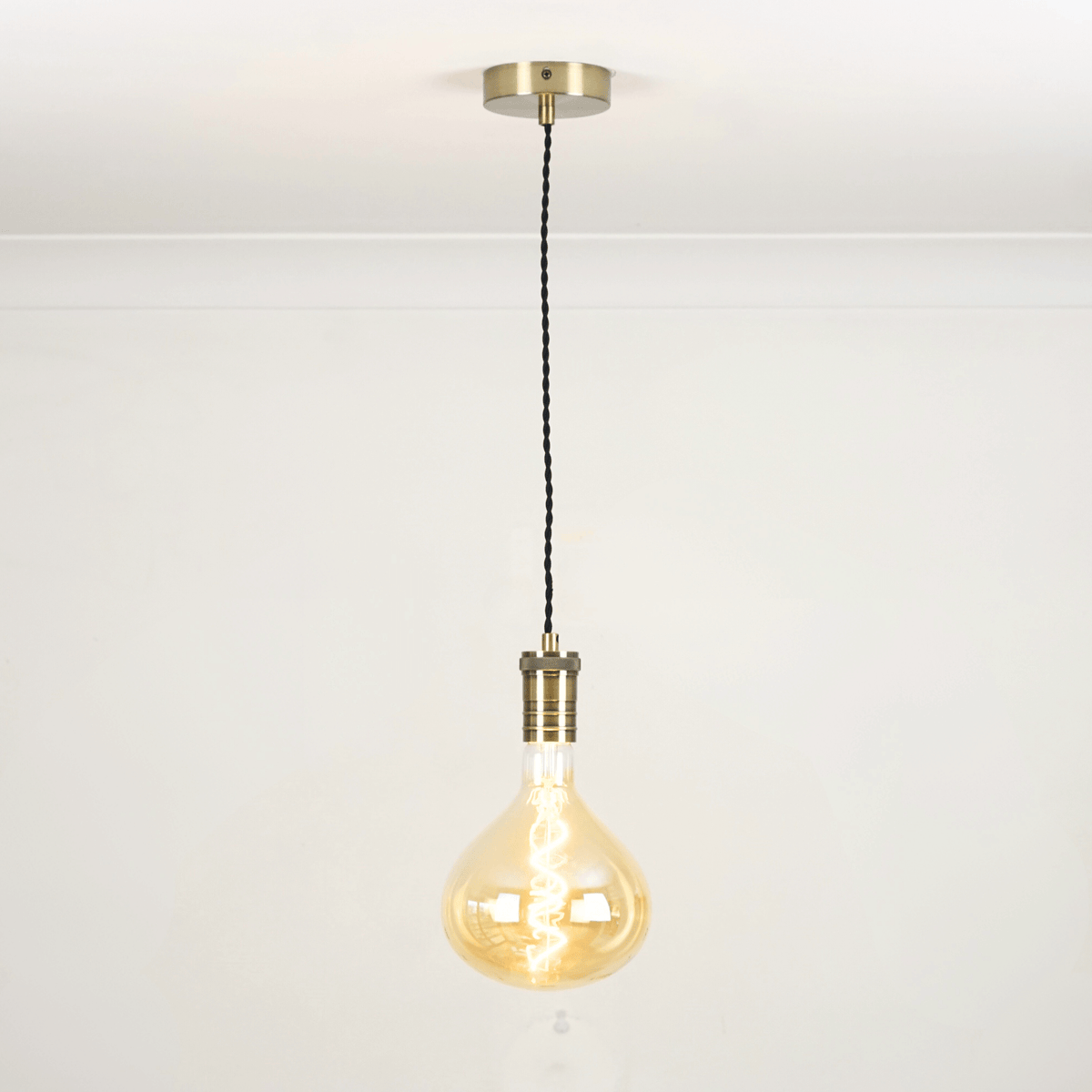 Bronze twisted single pendant white background with olivia bulb