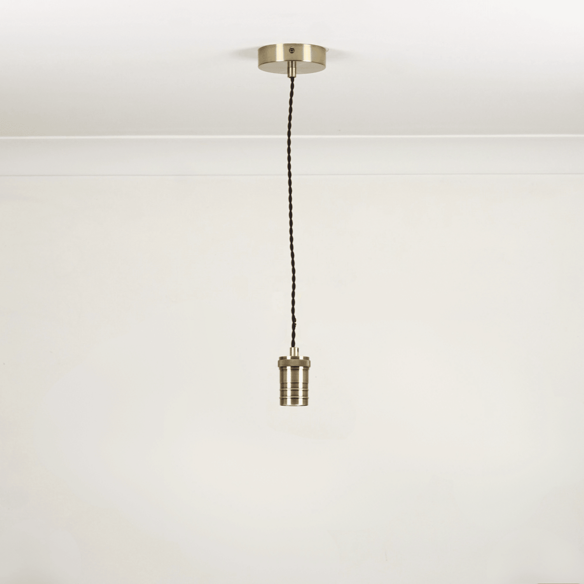 Bronze twisted single pendant white background 