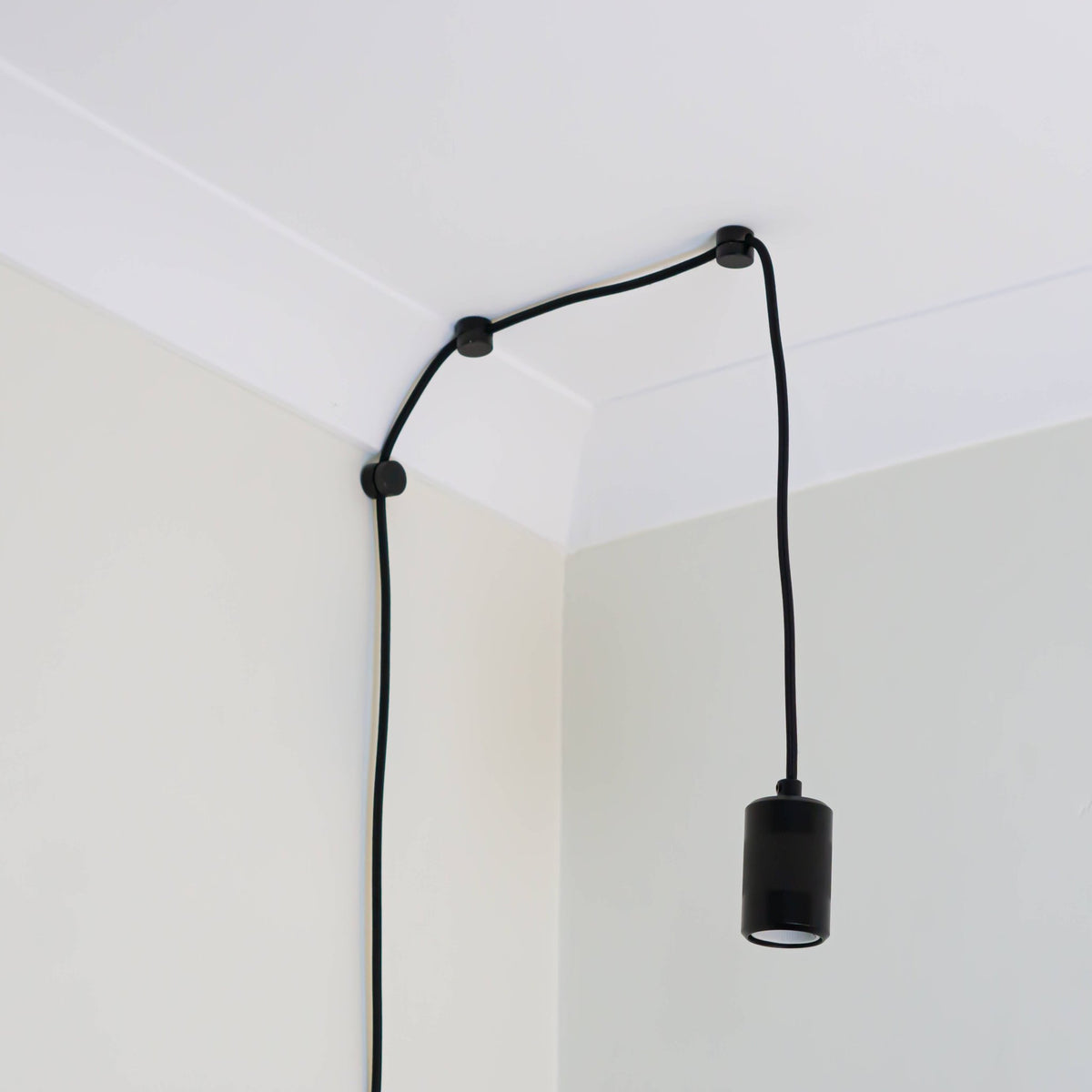 matte black plug in pendant light assembled with no bulb 