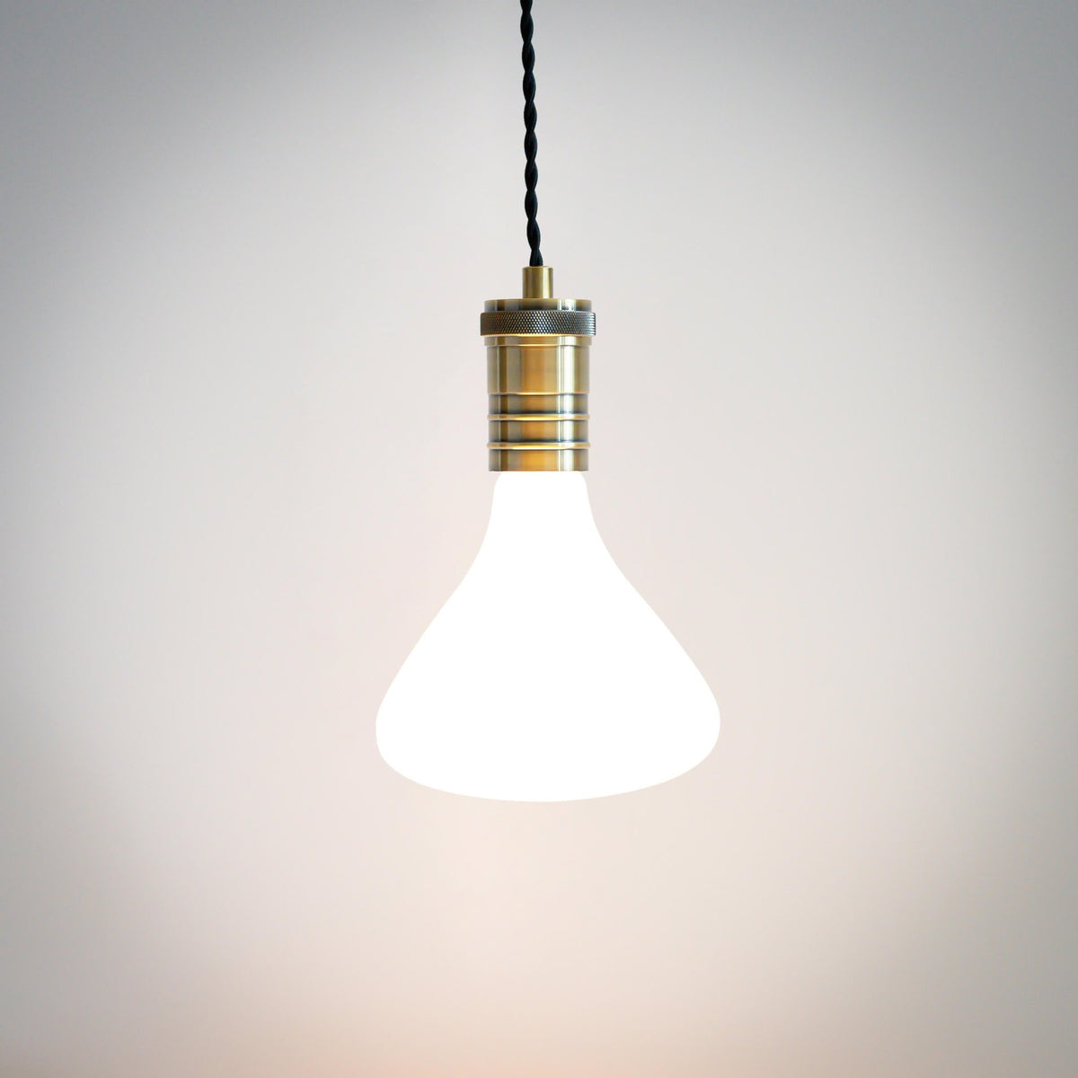 antique bronze pendant light with twisted cable and astrid bulb on