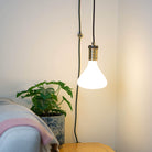 antique bronze plug in pendant light and straight cable astrid bulb in living room on