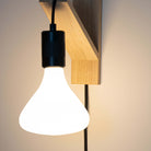 black plug in wall light in matte black  