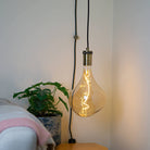 antique bronze plug in pendant light and straight cable with celeste bulb in living room on
