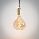 brass pendant light with twisted cable and olivia bulb on