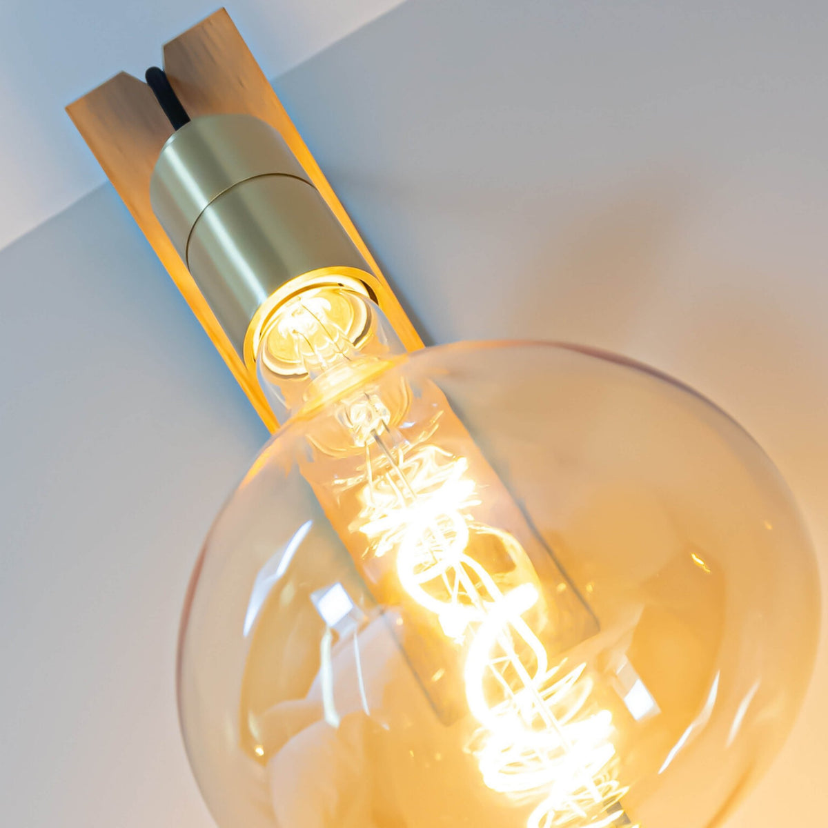olivia plug in wall light bulb closeup 