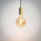 brass pendant light with twisted cable and sophia bulb on